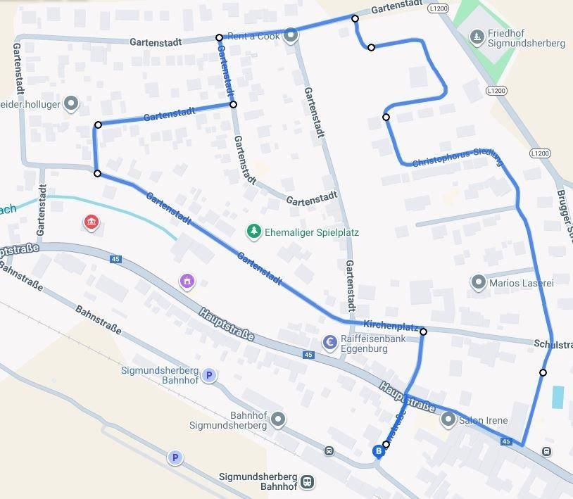 Eine Karte zeigt eine Route in einer Stadt, die bei einer Kirche beginnt und an einem Bahnhof endet, mit mehreren Haltestellen dazwischen.