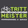 Das Logo von 'Tritt Meister' zeigt ein Fahrrad auf einer Kette, mit Text in fette grüner und weißer Schrift auf dunklem Hintergrund. Darunter steht 'FAHRRADHANDEL & SERVICE'.