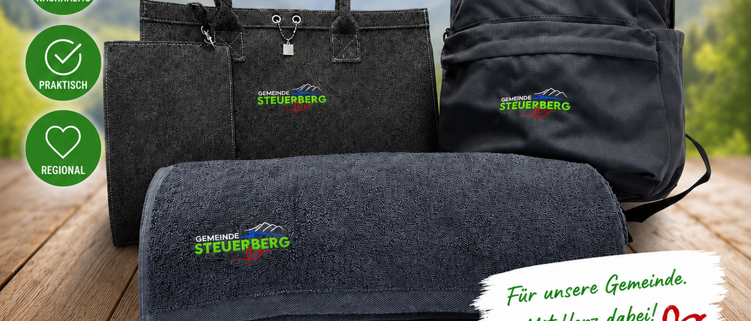 A poster shows a collection of eco-friendly items: a handbag, a backpack, and a blanket. All items are gray and feature Gemeinde Steuerberg branding. Icons for sustainability, practicality, and regional are also shown.