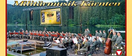Plakat für eine Militärmusik-Veranstaltung in Kränten. Die Veranstaltung ist für den 26. Juli 2025 um 19:30 Uhr geplant. Der Veranstaltungsort ist Seebühne Goggausee. Tickets sind für 19,90 Euro erhältlich.