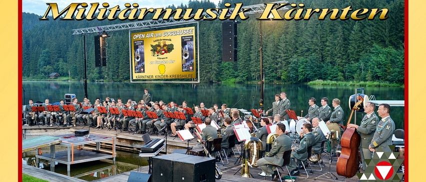 Plakat für eine Militärmusik-Veranstaltung in Kränten. Die Veranstaltung ist für den 26. Juli 2025 um 19:30 Uhr geplant. Der Veranstaltungsort ist Seebühne Goggausee. Tickets sind für 19,90 Euro erhältlich.