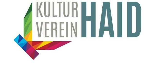 Das Logo des Kulturvereins Haid zeigt einen stilisierten Buchstaben L mit einem lebhaften mehrfarbigen Design, begleitet von dem Text 'Kultur Verein Haid' in fetten Buchstaben.