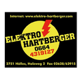Schwarzes Schild mit gelbem Text, 'Elektro Hartberger', Telefonnummer 4319127, Adresse 2751 Holles, Holzweg 2, Fax 02628/62915, Website www.elektro-hartberger.com.