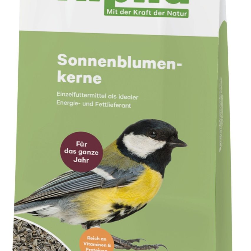 Eine Packung Sonnenblumenkerne, ideal für Vögel, mit einem Vogel auf grünem Hintergrund. Sie hebt den Energie- und Fettgehalt des Produkts hervor.