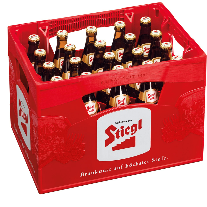 Ein roter Plastikkasten gefüllt mit 20 Flaschen Stiegl Bier, alle mit goldenen Verschlüssen. Der Kasten hat die Worte 'Stiegl' und 'Braukunst auf höchster Stufe' darauf geschrieben.
