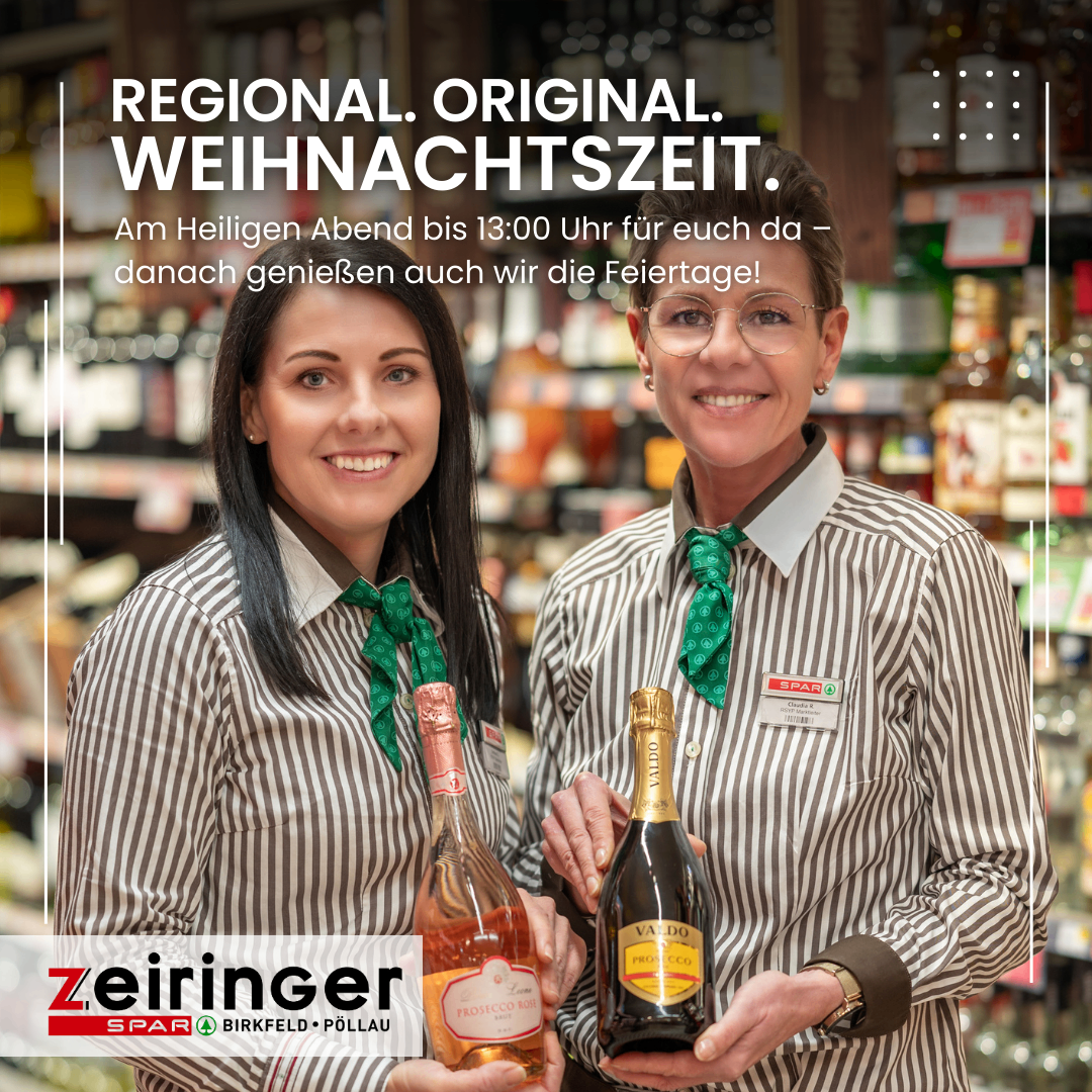 Zwei lächelnde Frauen in Uniform halten Weinflaschen in einem Geschäft. Eine Nachricht lautet: 'Regional. Original. Weihnachtszeit.' Ein Logo für Zeiringner ist sichtbar.