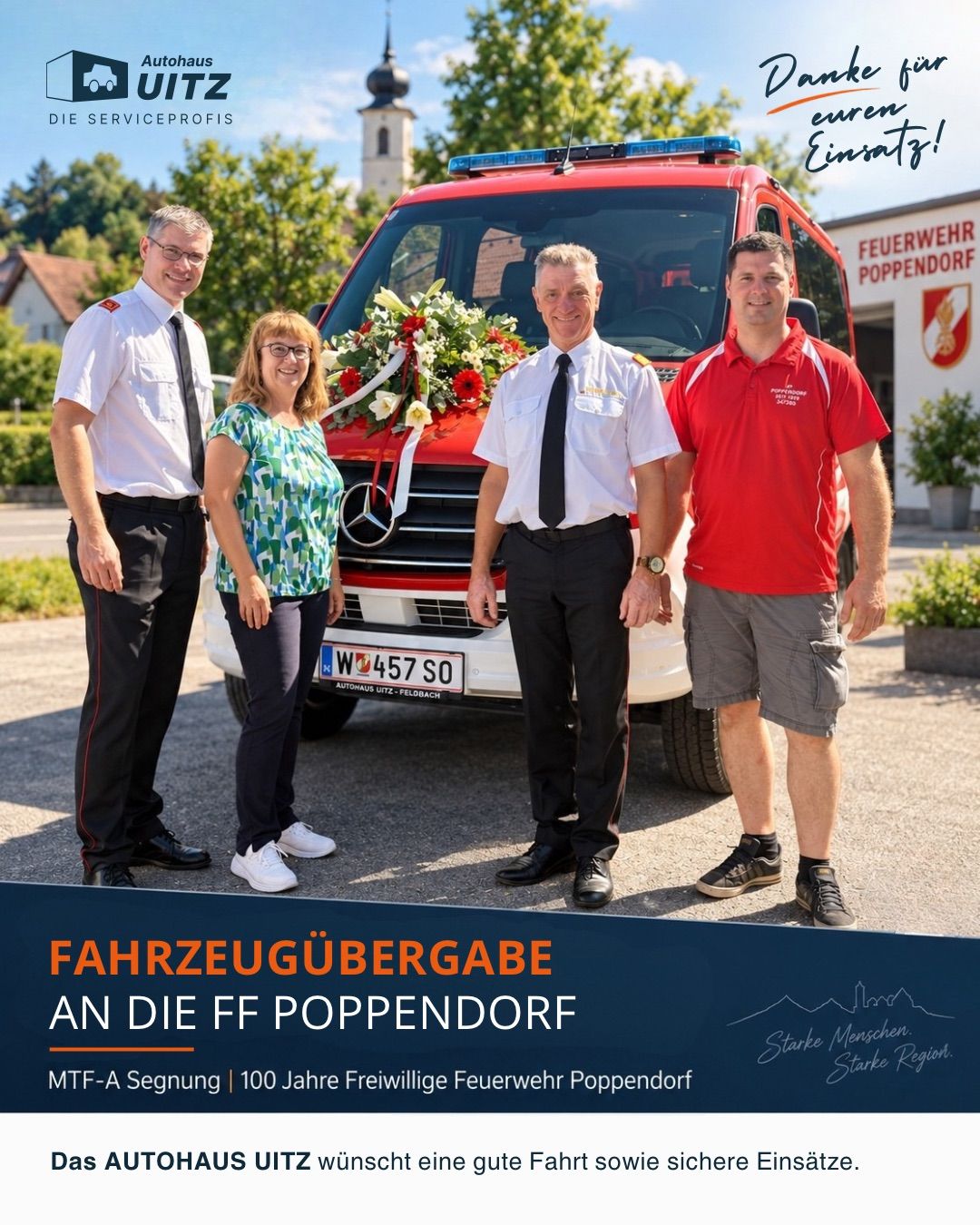 Four people stand in front of a red fire truck with a bouquet of flowers. The man on the left wears a black tie, the woman in the middle wears glasses, and the man on the right wears a red shirt. The fire truck has a license plate with the number W 457 SO.