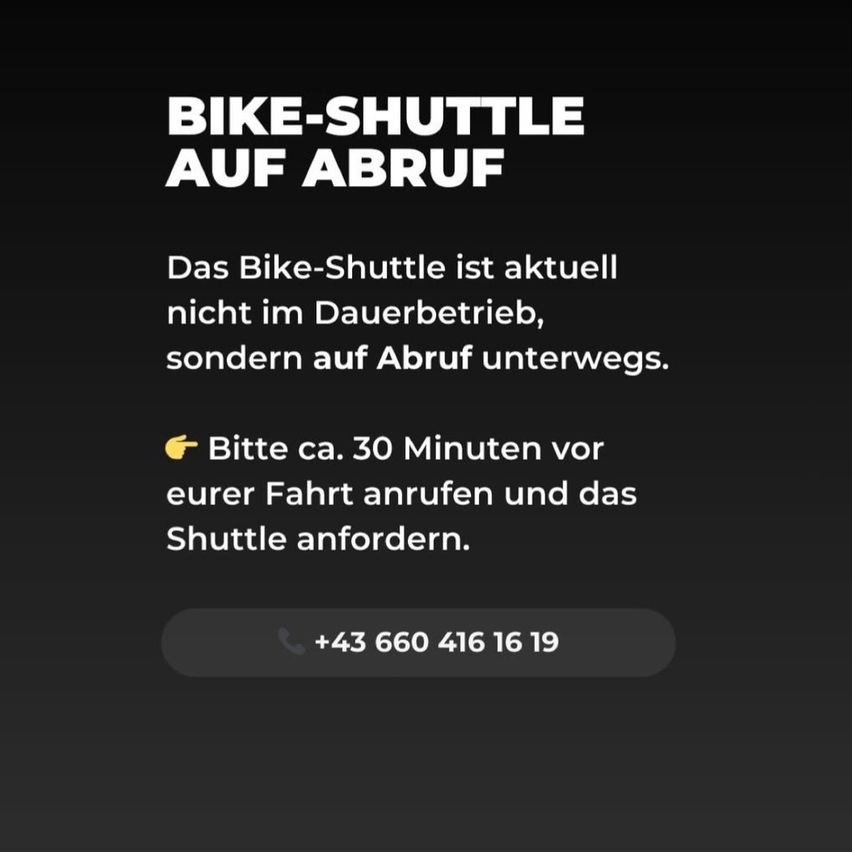 Ein schwarzer Bildschirm zeigt eine Meldung: 'BIKE-SHUTTLE AUF ABRUF'. Es heißt, 'Das Bike-Shuttle ist aktuell nicht im Dauerbetrieb, sondern auf Abruf unterwegs.' Es wird gebeten, 30 Minuten vor der Fahrt anzurufen. Die Nummer ist '+43 660 416 16 19'.