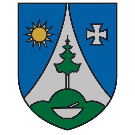 Das Wappen zeigt einen Berg mit einem Baum und einer Sonne auf blauem Hintergrund. Über dem Berg befindet sich ein weißes Kreuz. Im Vordergrund ist ein grüner Hügel mit einer weißen Schüssel darauf zu sehen.