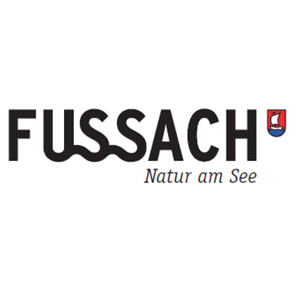 Fussach Nature at the Lake logo featuring blue and red shield with a sailboat and black text on white background