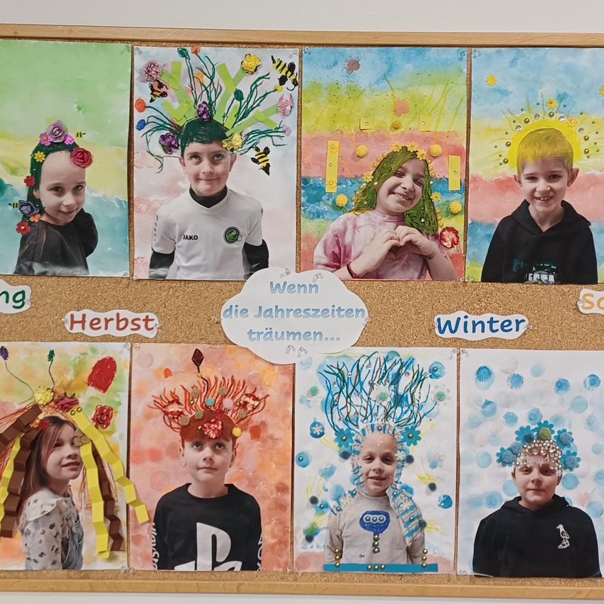 A bulletin board displays children's artwork themed around the four seasons, with each child's photo surrounded by decorations representing spring, summer, autumn, and winter.
