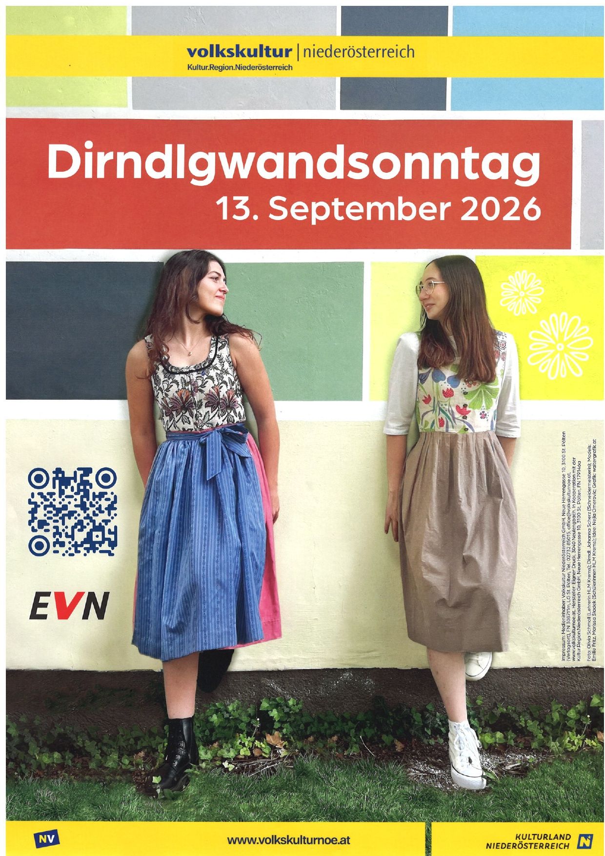 Two women in traditional clothing stand next to a colorful wall with text 'Dirndlgwandsonntag 13. September 2026' and a QR code.