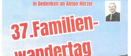 Poster for the 37th family hiking day, featuring a landscape with a village and mountains in the background, a man in a suit, and details about the event date, time, and location.