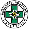 Ein Logo für den österreichischen Bergrettungsdienst, das ein grünes Kreuz mit einer Blume in der Mitte und den Text 'Bergrettungsdienst Osterreich' zeigt.