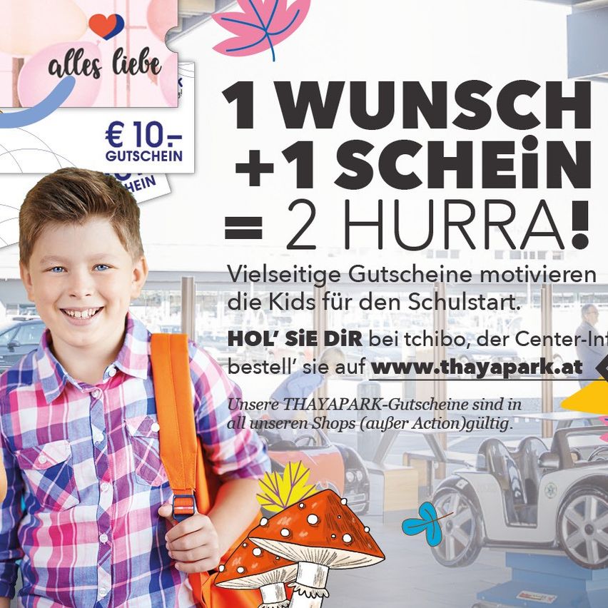 A poster advertising a shopping center with a smiling boy holding a backpack. The poster includes a slogan '1 WISH + 1 COIN = 2 HURRA!' and mentions vouchers for the school start.