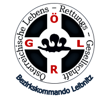 Das Logo zeigt ein Kreuzsymbol mit den Buchstaben GR in der Mitte, umgeben von dem Text Bezirkskommando Lebensretter Rettungs-Greif. Das Logo ist in Schwarz und Weiß.