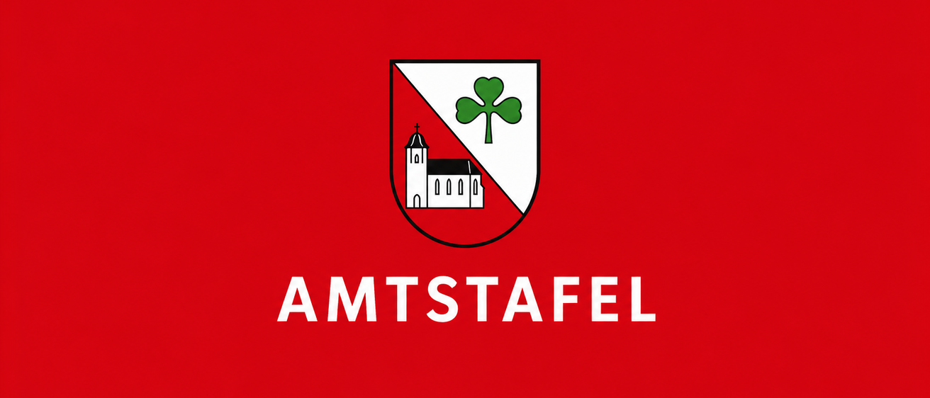 Das Logo für Amt Staffel zeigt einen roten Hintergrund mit einem weißen Schild. Der Schild hat ein grünes Kleeblatt und eine weiße Kirche mit Turm. Der Text 'AMT STAFEL' ist in Weiß über dem Schild geschrieben.
