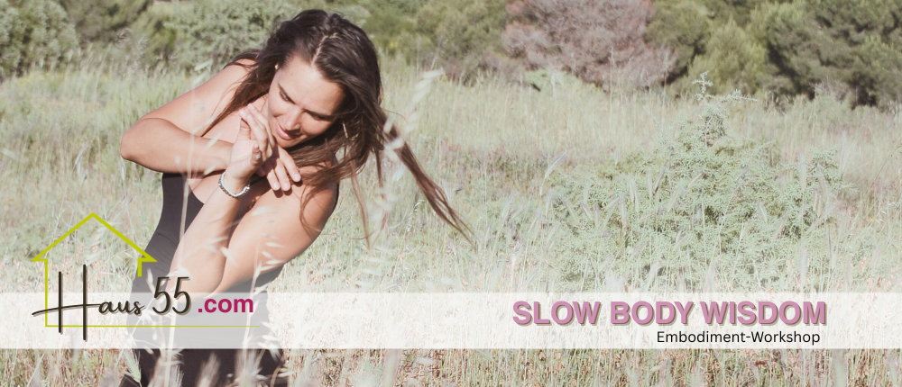 A woman in a field, embracing herself, appears contemplative. The field is lush with tall grass. The website 'slowbodywisdom.com' is visible.