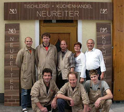 People, Person, Adult, Male, Man, Groupshot, Pants, Coat, Blackboard, Face