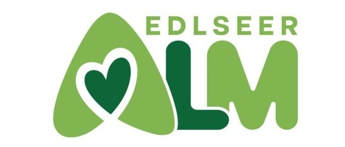 Logo für Edlseer LM, mit einem grünen Herz und den Buchstaben LM in einer stilisierten Schrift.