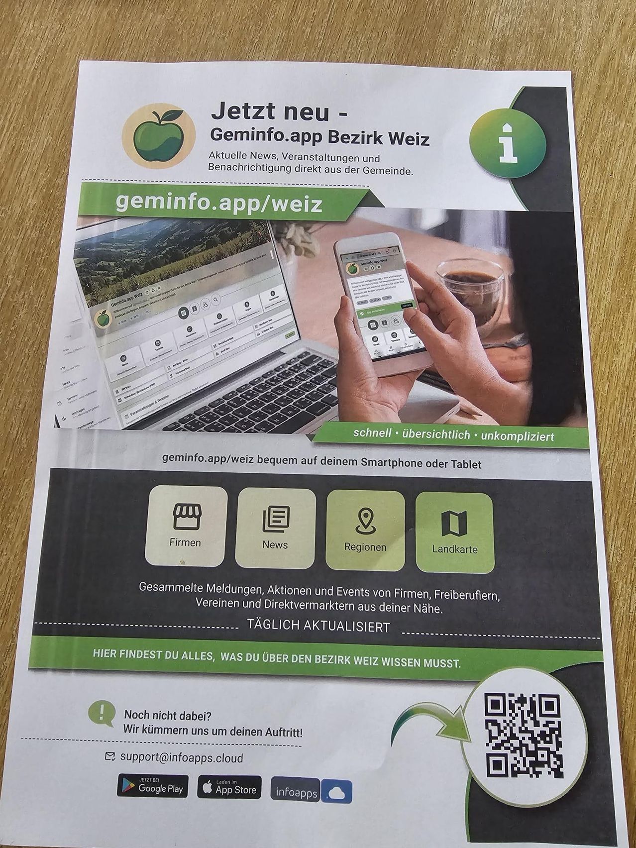 Eine Werbung für die Geminfo.app, eine lokale Nachrichten-App für Weiz, Österreich. Sie zeigt einen QR-Code, Symbole für Firmen, Nachrichten, Regionen und Landkarte sowie einen Slogan, der alles über die Region Weiz erfahren lässt.
