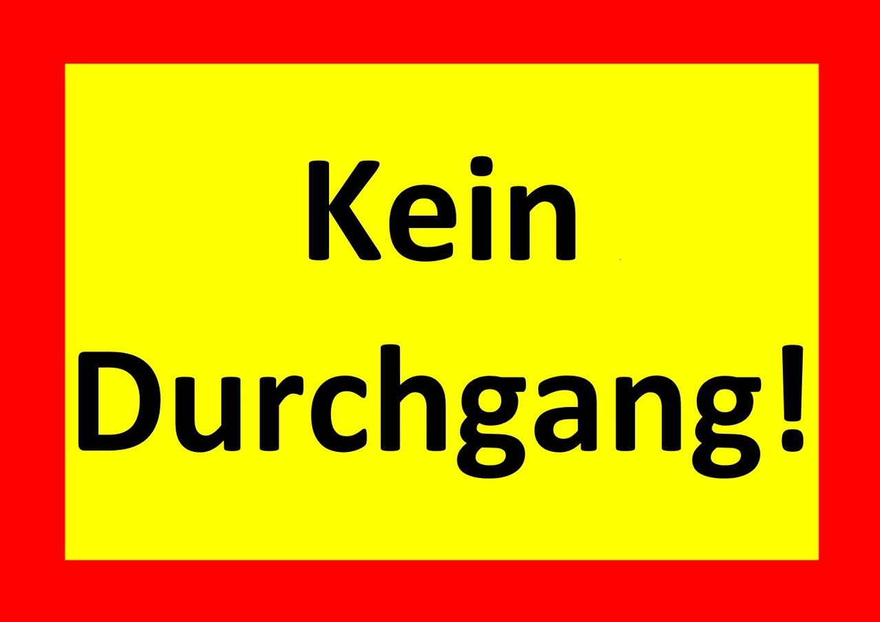A yellow background with black text reading 'Kein Durchgang', likely indicating a no-entry sign.