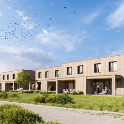 Eine Darstellung eines Wohngebiets mit mehreren Holzgebäuden mit Fenstern und Türen. Ein Paar steht vor einem der Gebäude.