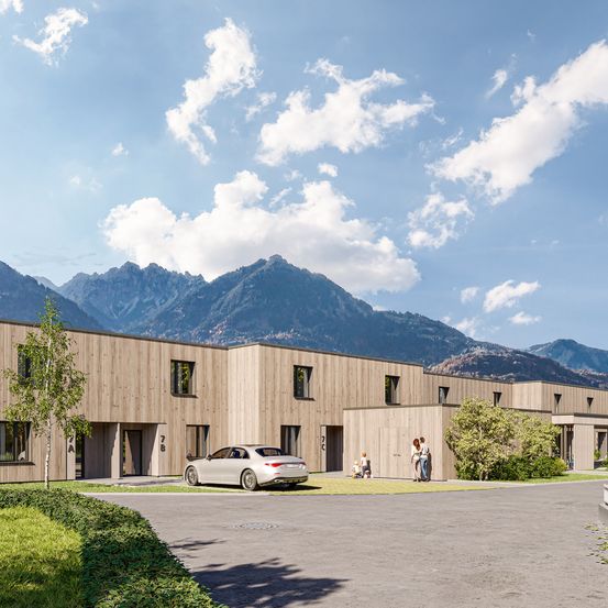 Eine künstlerische Darstellung eines modernen Gebäudes mit holzverkleideter Fassade, vor einer Bergkulisse.