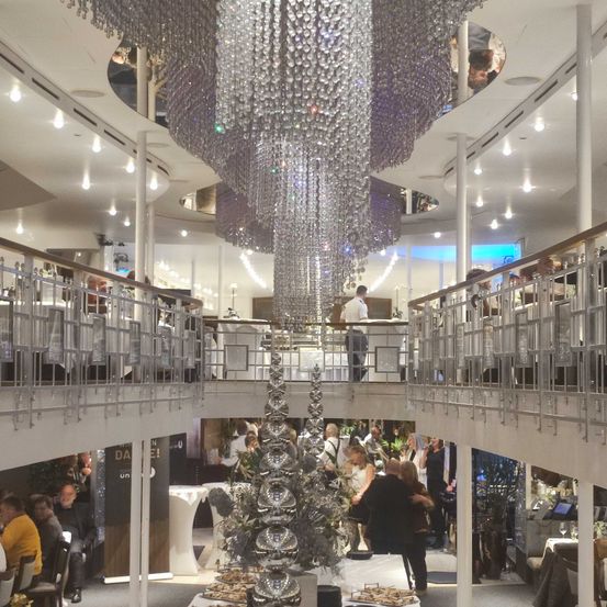 Chandelier, Shopping Mall, Indoors, Dining Table, Person, Restaurant, Monitor, Dining Room, Plate, Shoe