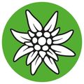 Eine stilisierte weisse Blume mit mehreren Blütenblättern befindet sich zentral in einem grünen Kreis. Die Blume hat einen gelben Mittelpunkt mit mehreren weissen Punkten.