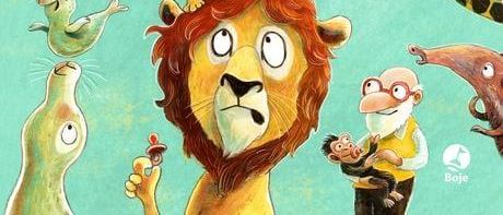 Ein farbenfrohes Buchcover mit verschiedenen Tieren und einem Löwen in der Mitte. Der Titel 'Nachwuchs im Zoo' steht in roten Buchstaben.