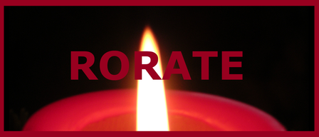 A close-up of a candle with the word 'RORATE' in red capital letters on a dark background. The candle's flame is bright, casting a warm glow.