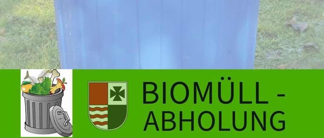 An outdoor blue trash can on grass, labeled 'Biomuell-Abholung' with a graphic of a trash can with waste and a town crest. Website: www.wartberg-aist.at.