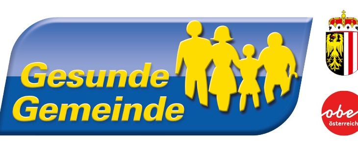 Ein blaues und gelbes Logo mit dem Text 'Gesunde Gemeinde', das eine Familiensilhouette und ein Kronensymbol zeigt.
