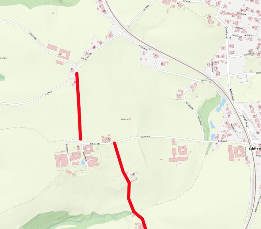 Eine Karte mit einer roten Linie, die zwei Punkte verbindet, umgeben von Gebäuden und Straßen.