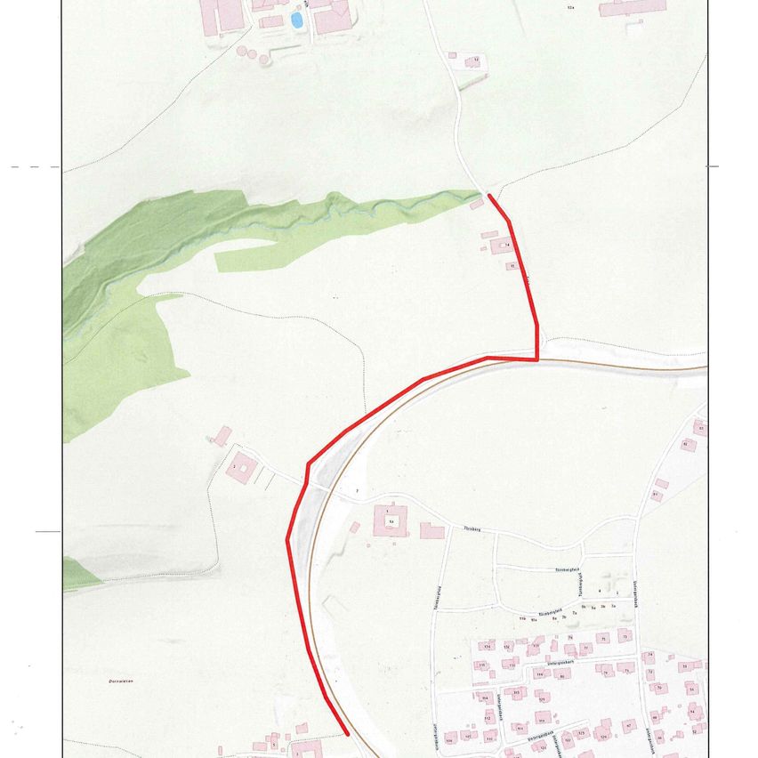 A map shows a rural area with a red line marking a boundary. Green areas represent vegetation, and a settlement is visible.
