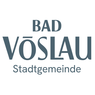 Auf schwarzem Hintergrund mit weißem Text steht 'BAD VOSLAUE Stadtgemeinde', vermutlich der Name einer Stadt oder Gemeinde in Deutschland.