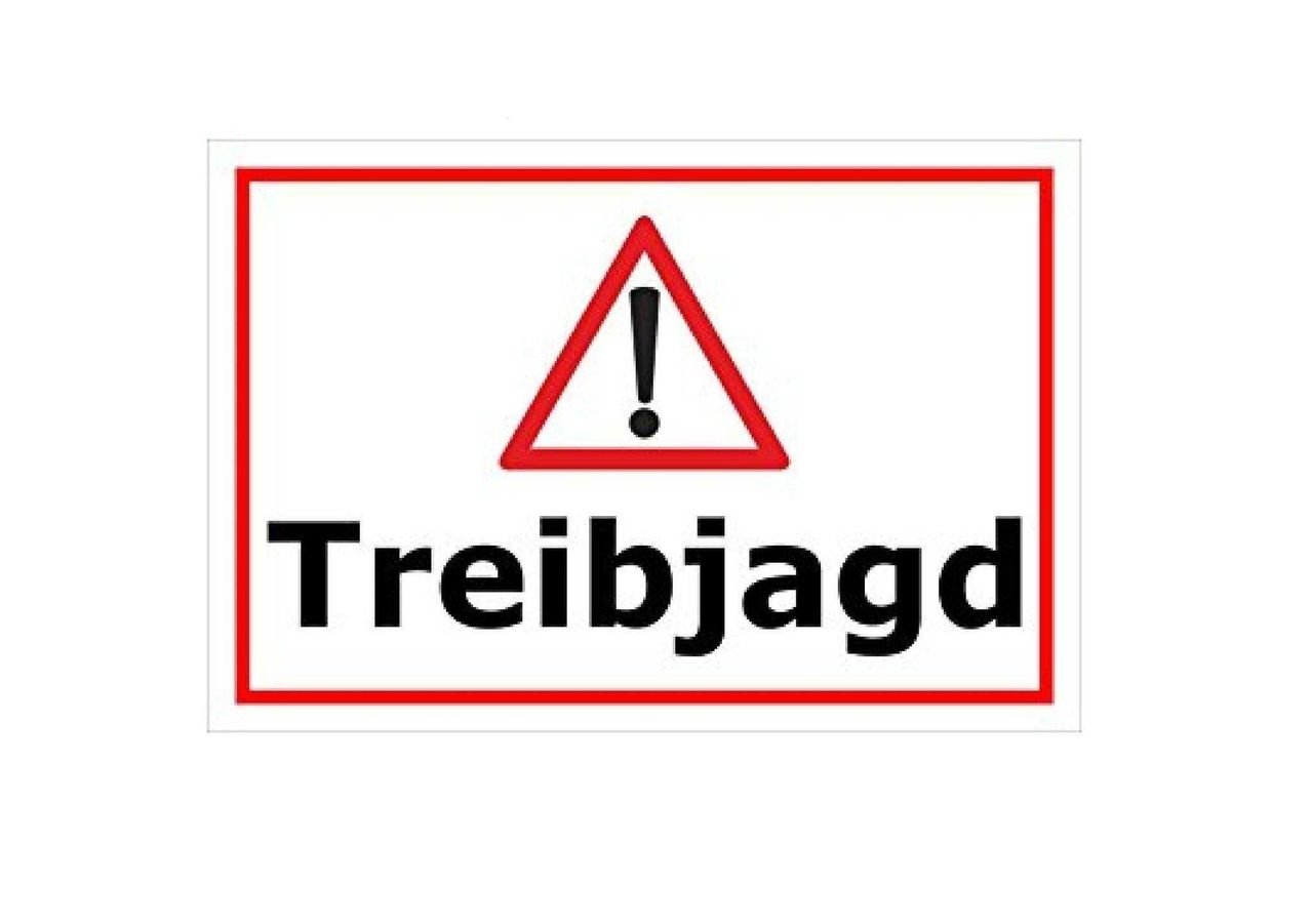 Ein rotes Schild mit weißem Hintergrund enthält ein Ausrufezeichen in einem roten Dreieck, mit dem Wort 'Treibjagd' darunter.
