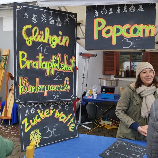 Image contains, Blackboard, Text, Clothing, Coat, Person, Portrait