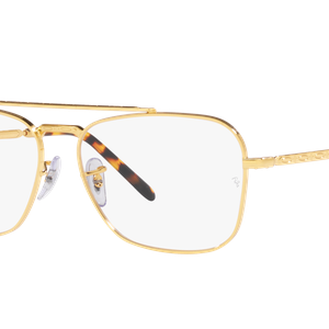 Ein Paar goldfarbener Sonnenbrille mit weißen Gläsern und brauner Tönung. Die Gläser haben eine leichte Krümmung und sind in rechteckiger Form gefasst.