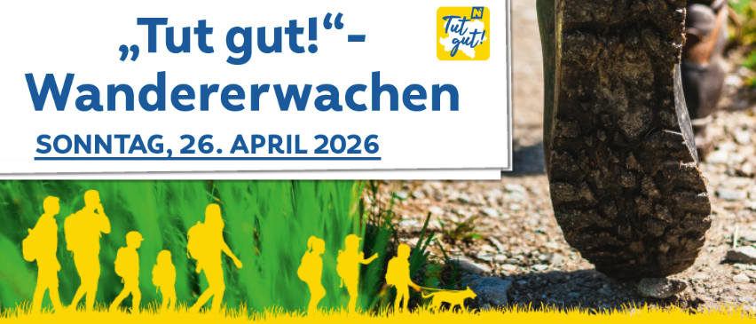 A poster with the text 'Tut gut! Wandern' and a silhouette of people walking with a dog. It is scheduled for Sunday, April 26, 2026.