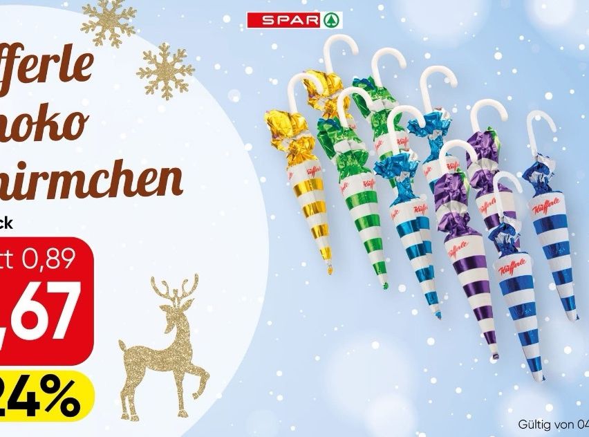 Rabattanzeige für festliche Schokoladen bei Spar. Es zeigt verpackte Schokoladen in verschiedenen Farben und Designs mit Schneeflocken und einem Rentier. Preis ist 57% reduziert von 9,89 Euro. Gültig.