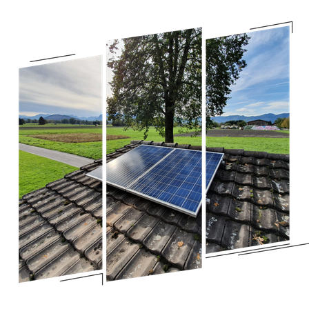 Eine Solarpanel-Anlage ist auf einem Dach installiert, umgeben von einem grünen Feld und einem Baum. Die Landschaft zeigt eine kurvenreiche Straße und entfernte Berge.