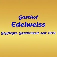 Ein gelber Hintergrund mit blauem Text, der Gasthof Edelweiss lautet, gefolgt von einer Zeile, die gepflegte Gastlichkeit seit 1919 sagt.