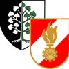 Das Bild zeigt zwei heraldische Wappen. Das linke ist schwarz und weiß mit einem Baum, der herzförmige Blätter hat. Das rechte Wappen ist rot und weiß mit einer goldenen Flamme und einem Zahnrad-Emblem.