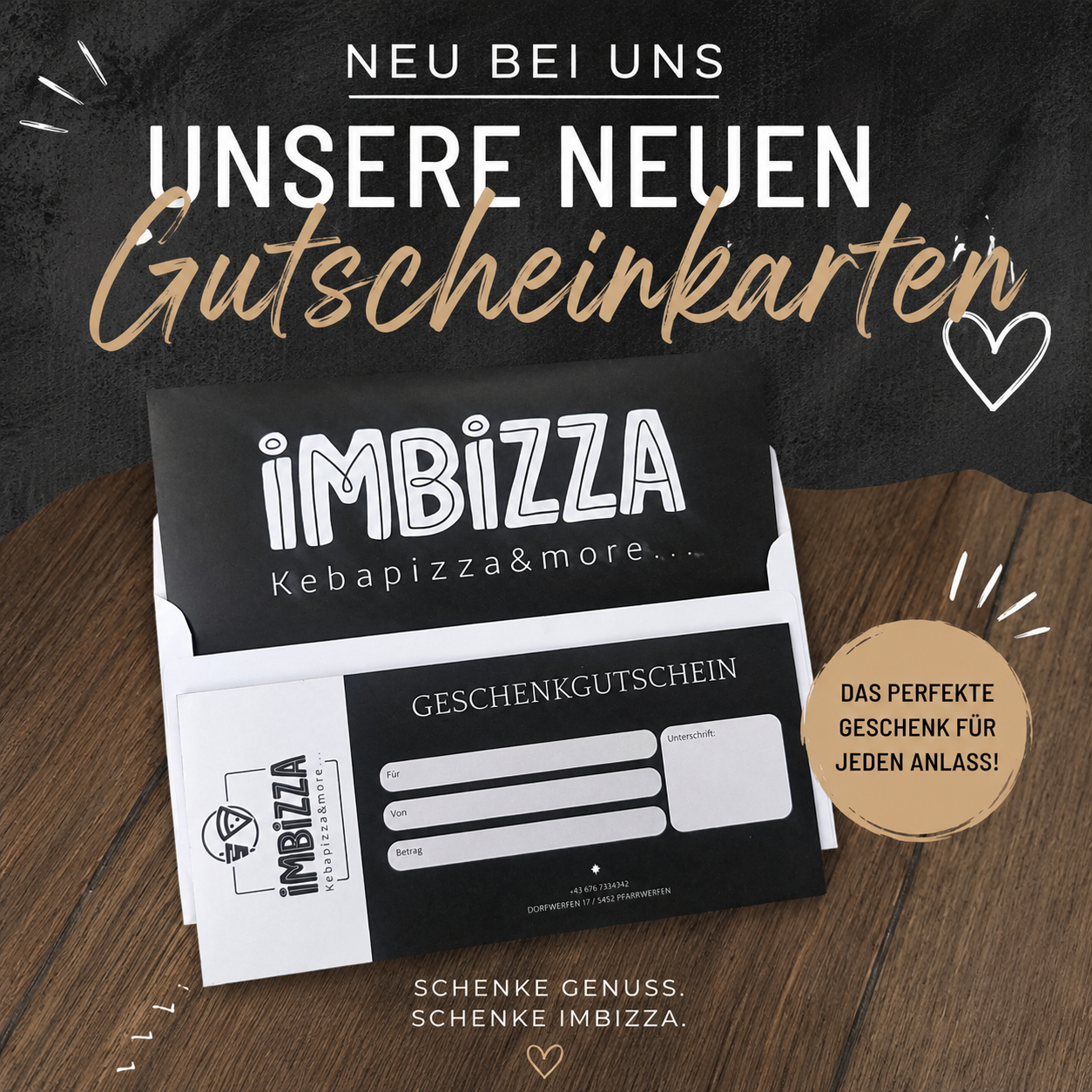 A promotional image for iMBiZZA's new gift cards. The cards are displayed on a wooden surface with a black background. The cards have a black and white design with the iMBiZZA logo and the text 'Kebabpizza & more...'. The text 'GESCHENKGUTSCHEIN' is written in white on the card. The image has a heart-shaped design on the top right corner.