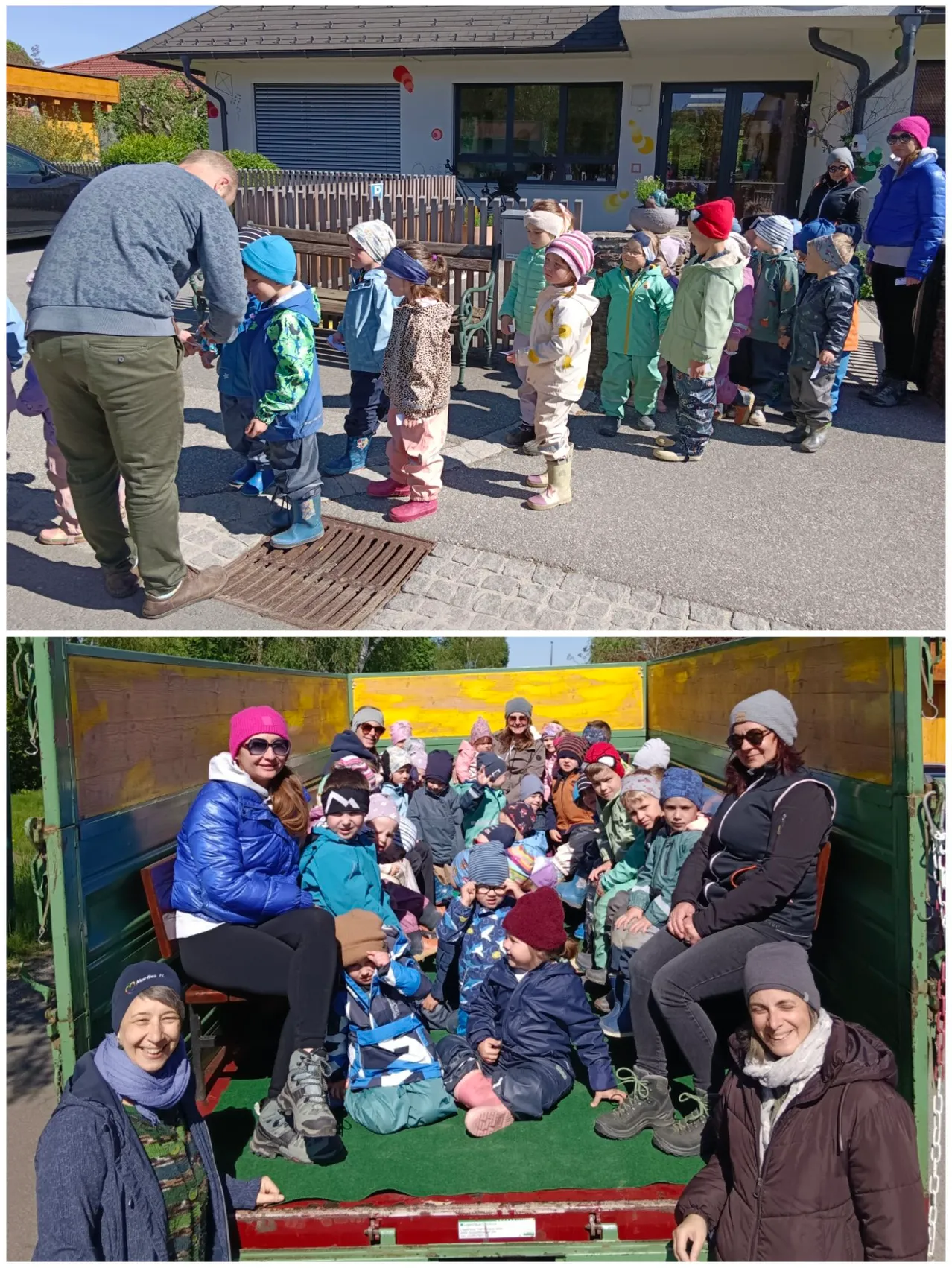 Eine Gruppe von Kindern und Erwachsenen ist draußen. Einige stehen in einer Reihe und andere sitzen in einem grünen Container. Die Erwachsenen lächeln.
