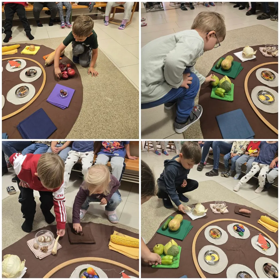 Eine Gruppe von Kindern versammelt sich um einen Tisch mit verschiedenen Lebensmitteln darauf. Einige knien und nehmen Lebensmittel auf, während andere auf dem Boden sitzen.