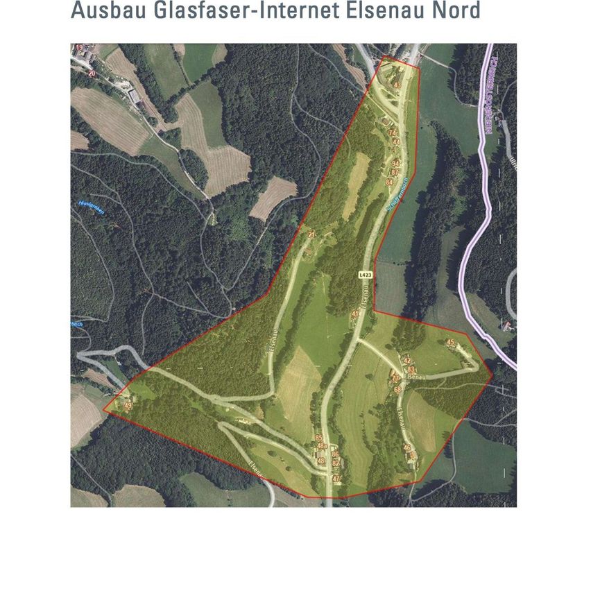 Aerial map of a rural area with a marked property, surrounded by fields, trees, and roads. The property is highlighted in red.