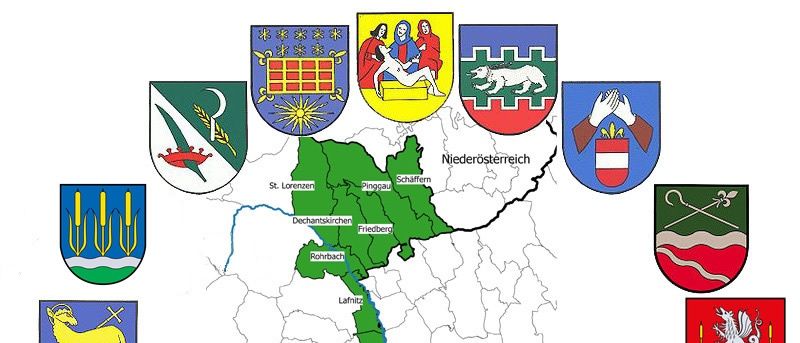 Eine Karte österreichischer Regionen mit verschiedenen Wappen. Jedes Wappen symbolisiert eine andere Region. Der zentrale Bereich ist grün hervorgehoben. Die Karte enthält Namen wie Niederösterreich, Burgenland und andere.